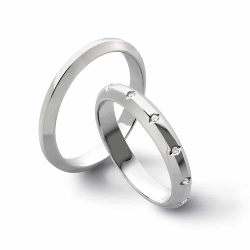Coppia di fedi matrimoniali in oro bianco e diamanti